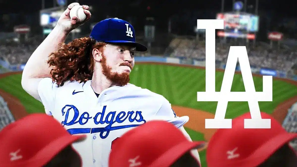 Dodgers Dustin May throwing a pitch next to a Dodgers logo in front of Dodgers stadium