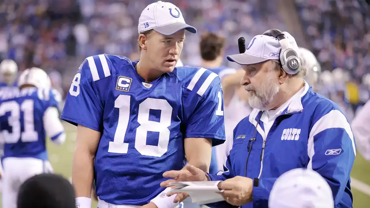 Indianapolis Colts quarterback Peyton Manning,left,spoke with offensive line coach Howard Mudd,right, in the fourth quarter ofa game afternoon at Lucas Oil Stadium. 