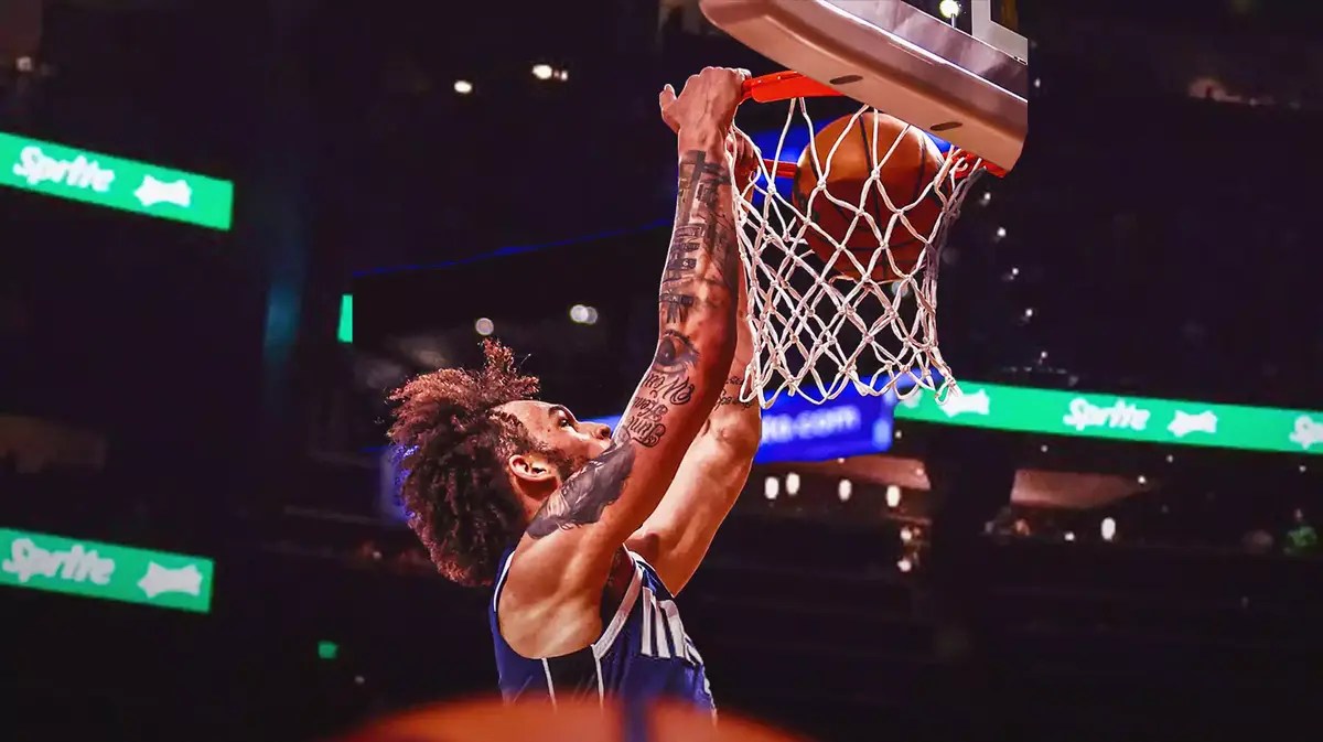 Mavericks' Dereck Lively II dunking a basketball.