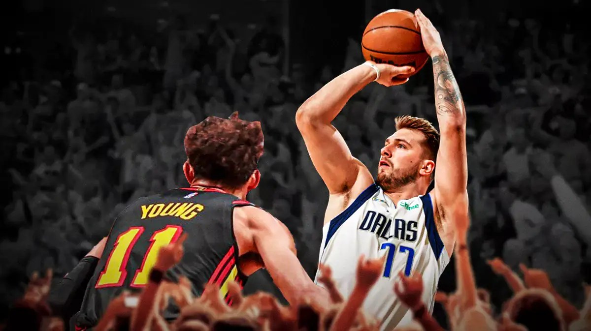 Mavericks' Luka Doncic shooting a basketball with Hawks' Trae Young playing defense against him.