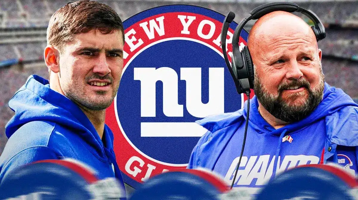 Giants Daniel Jones and Brian Daboll next to a Giants logo at MetLife Stadium