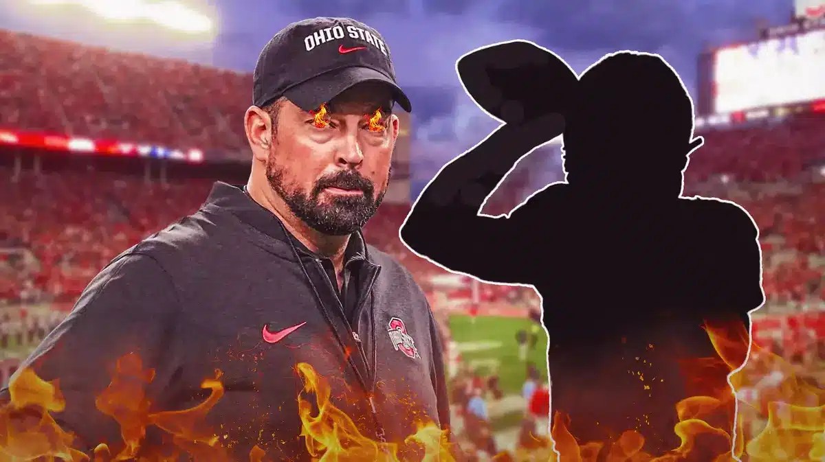 Ohio State football coach Ryan Day with fire in his eyes. Silhouette of Will Howard in the background