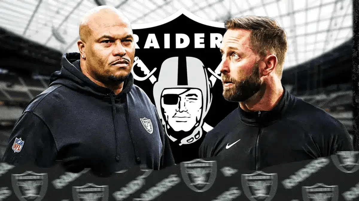 Antonio Pierce and Commanders OC Kliff Kingsbury in front of a Raiders logo at Allegiant Stadium