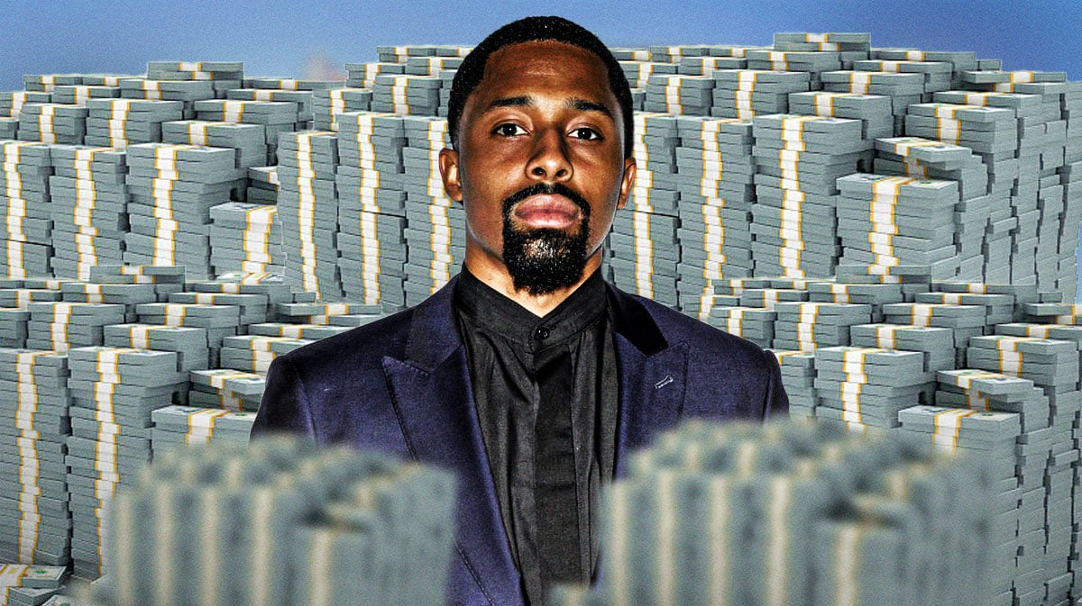 Spencer Dinwiddie surrounded by piles of cash.