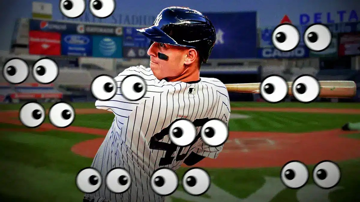 Yankees' Anthony Rizzo swinging a baseball bat. Place the eyes emoji all over the image pointed toward Rizzo.