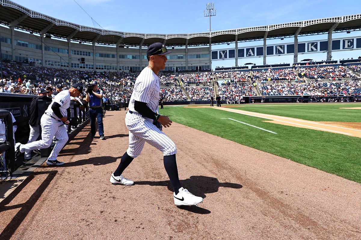 New York Yankees right fielder Aaron Judge (99) runs out onto the field prior to the game against the Atlanta Braves at George M. Steinbrenner Field