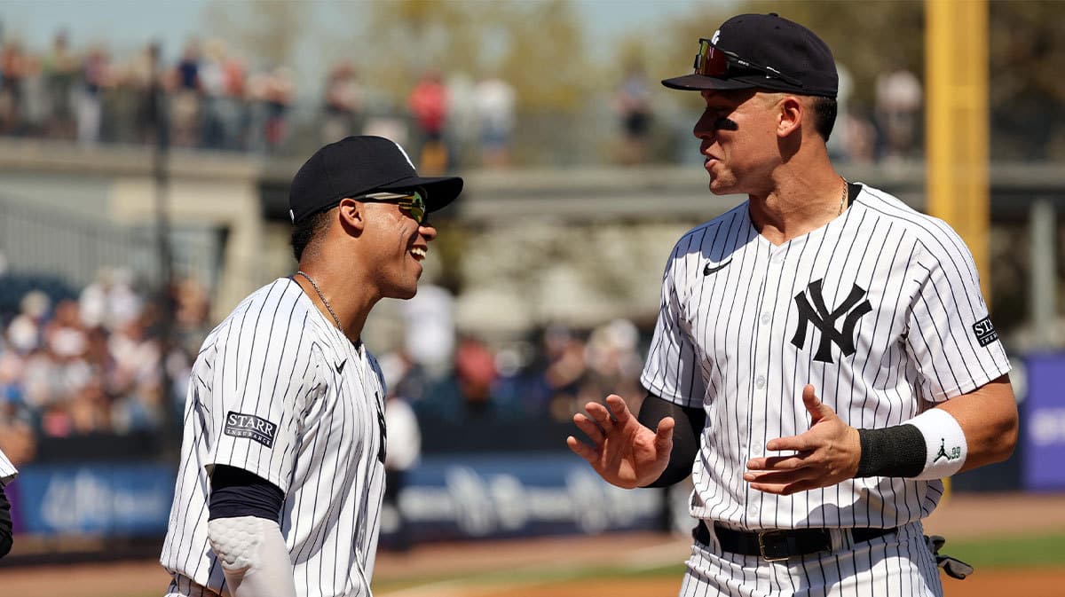 New York Yankees left fielder Juan Soto (22) and right fielder Aaron Judge (99) talks prior to the game against the Toronto Blue Jays at George M. Steinbrenner Field. 