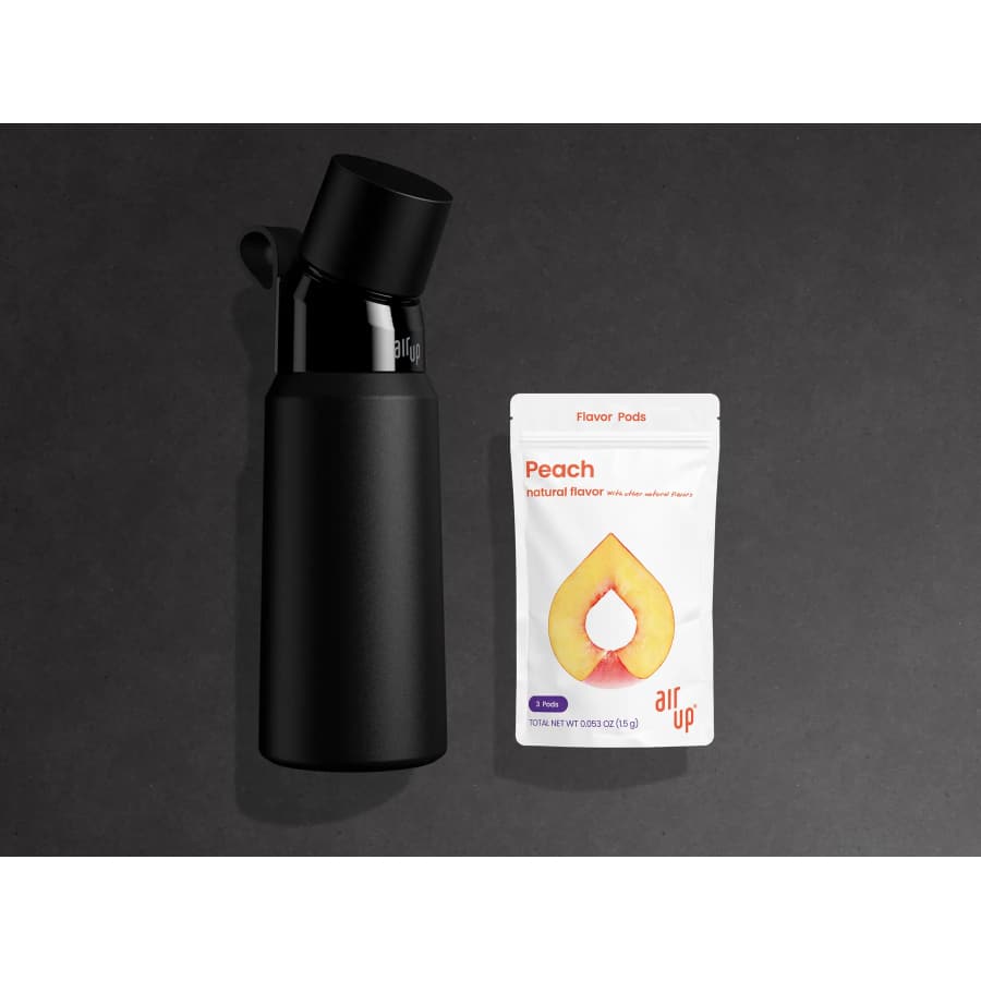 Promotional image of the Air Up Water Bottle 28oz Steel bottle + Peach pods (3-pack) - Black bottle on a black background.