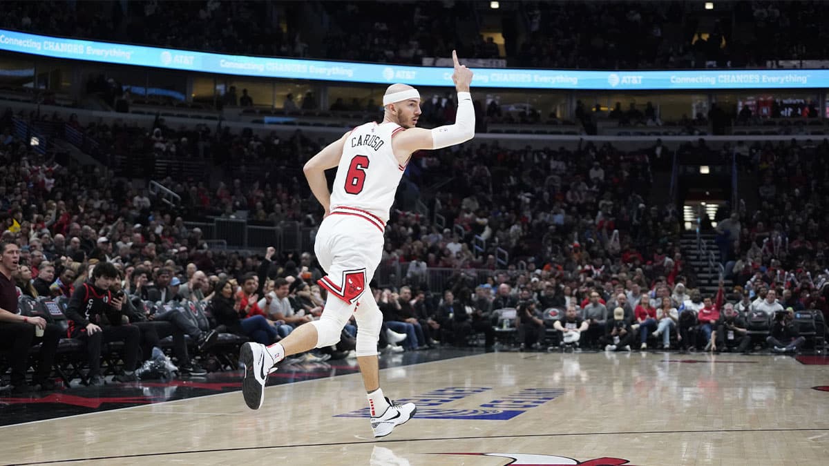 Chicago Bulls guard Alex Caruso (6) reacts after making a three point basket against the Indiana Pacers during the second half at United Center. 