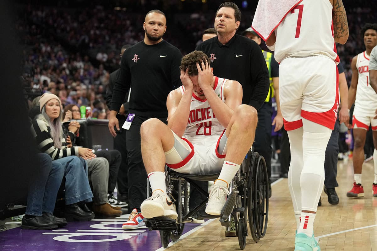 Houston Rockets center Alperen Sengun (28) is wheeled off of the court after suffering an injury against the Sacramento Kings during the fourth quarter at Golden 1 Center.