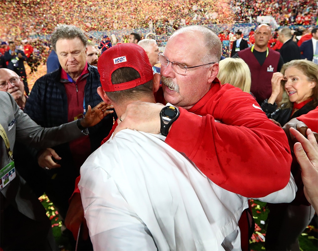 Kansas City Chiefs head coach Andy Reid meets with San Francisco 49ers head coach Kyle Shanahan after Super Bowl LIV at Hard Rock Stadium.