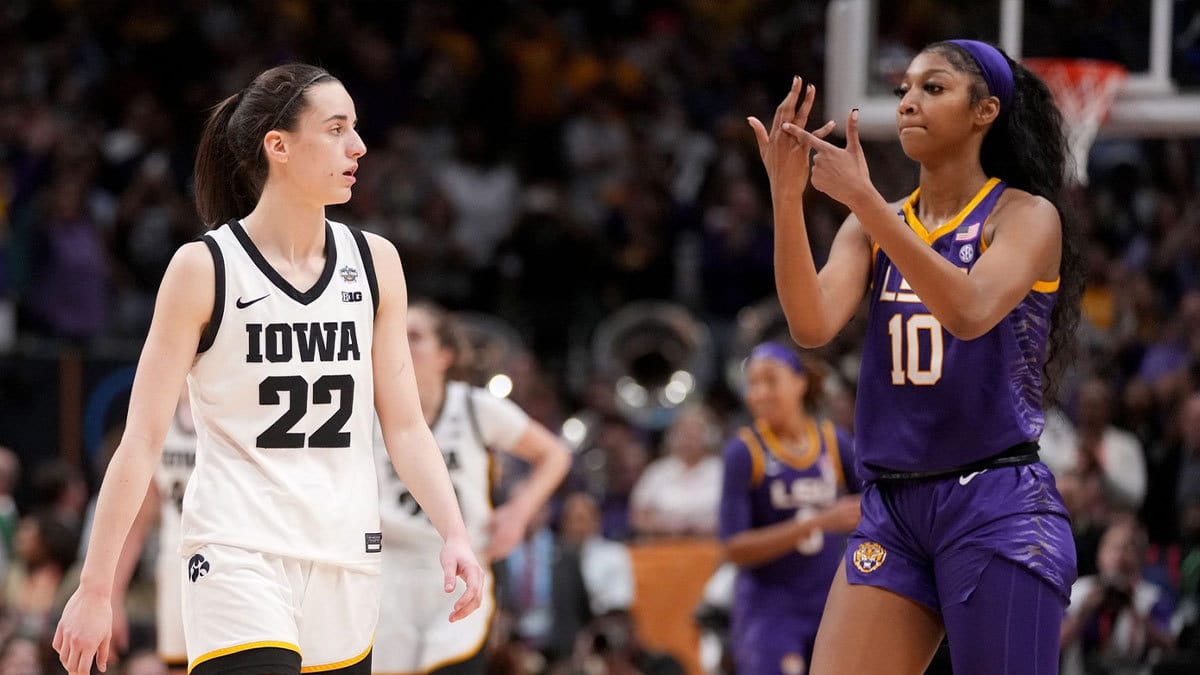 In one of the iconic moments of last year's NCAA women's tournament, Angel Reese of LSU points to her ring finger as Iowa's Caitlin Clark can only watch during the national championship game. LSU defeated Iowa 102 85.