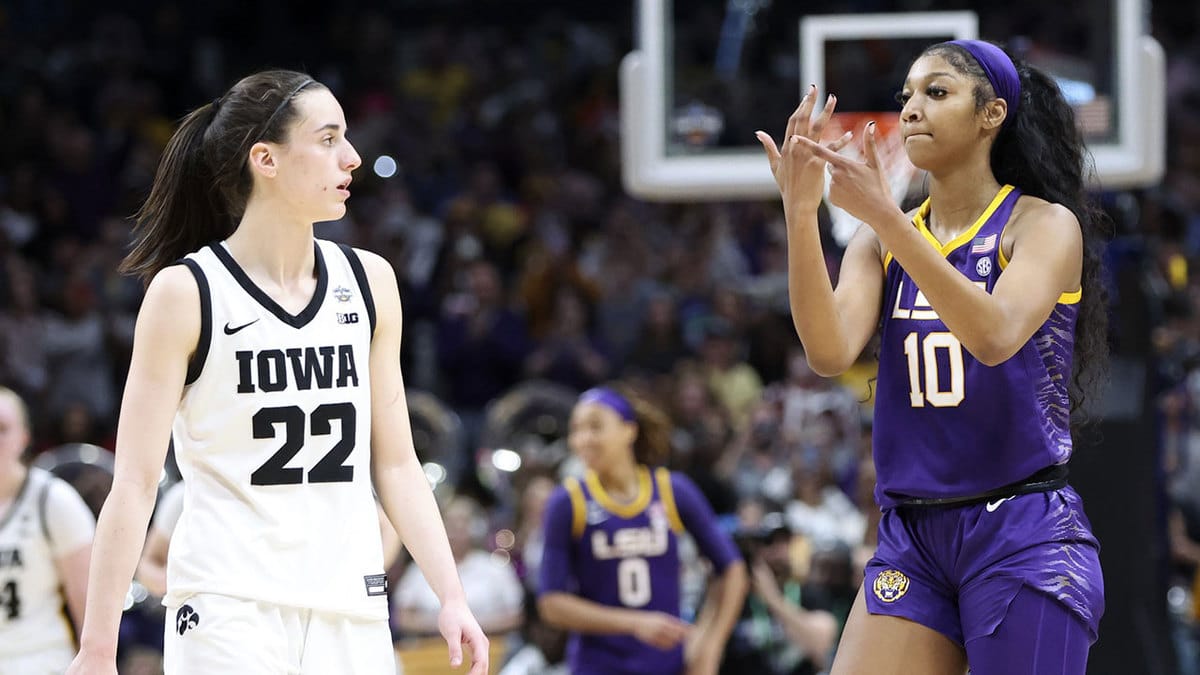  LSU Lady Tigers forward Angel Reese (10) gestures to Iowa Hawkeyes guard Caitlin Clark (22) after the game during the final round of the Women's Final Four NCAA tournament at the American Airlines Center