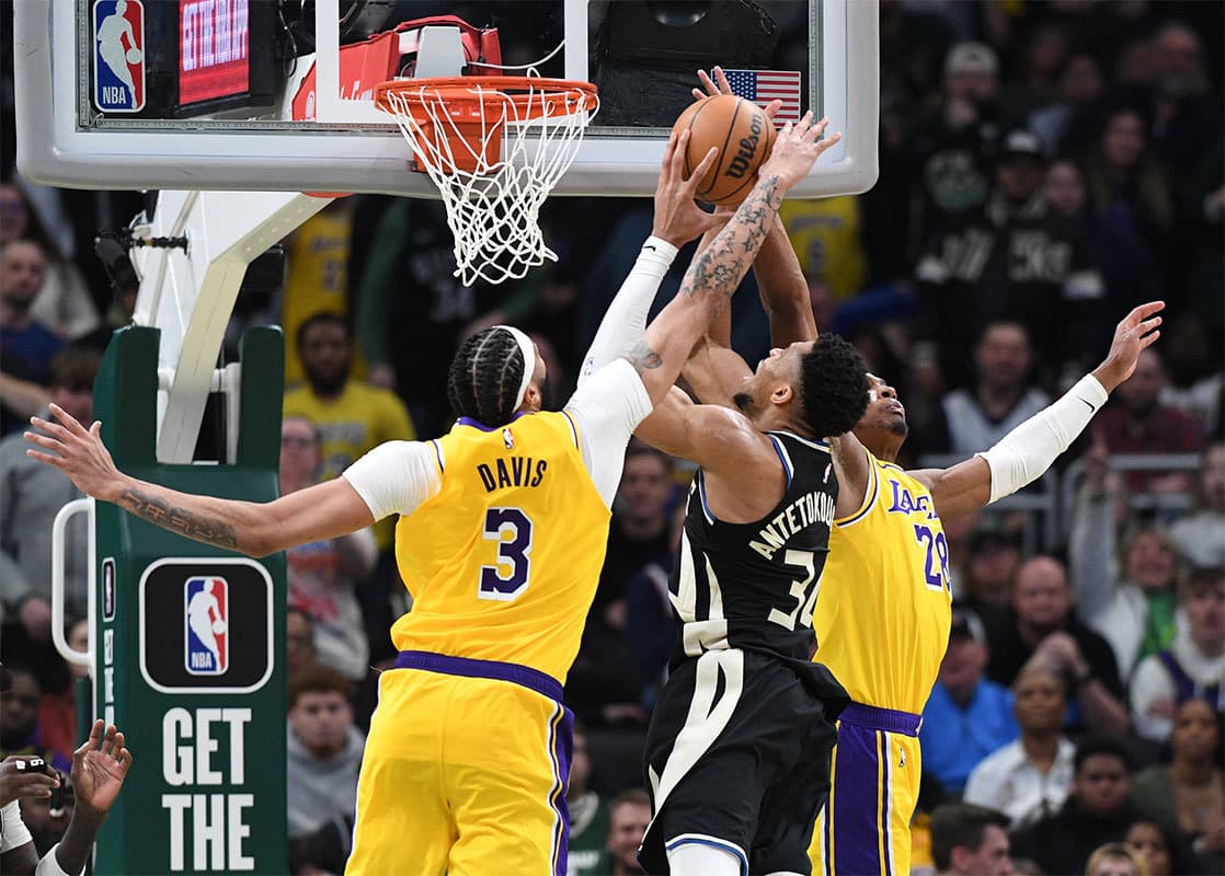 Milwaukee Bucks forward Giannis Antetokounmpo (34) puts up a shot against Los Angeles Lakers forward Anthony Davis (3) and Los Angeles Lakers forward Rui Hachimura (28) in the second overtime at Fiserv Forum.