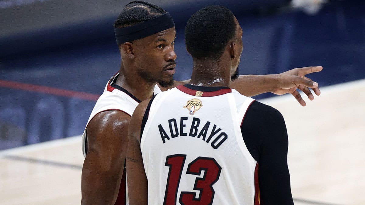 Miami Heat forward Jimmy Butler (22) and center Bam Adebayo (13) talk in the second quarter against the Denver Nuggets in game two of the 2023 NBA Finals at Ball Arena.