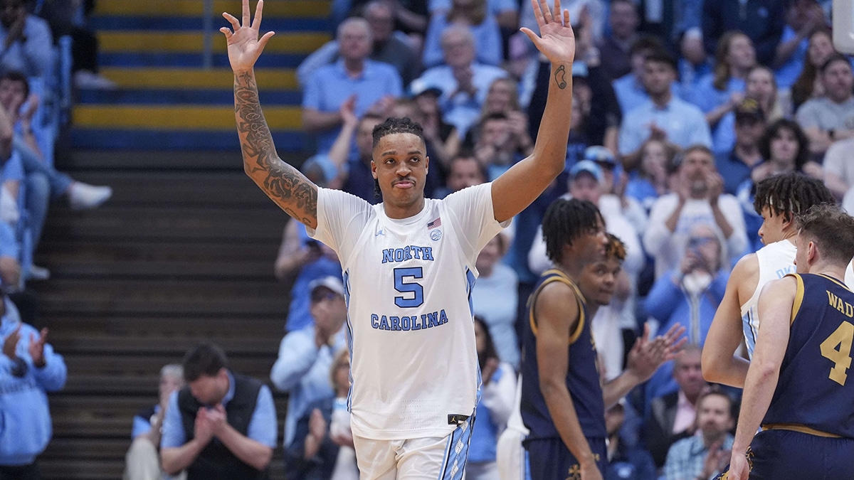 Tar Heels forward Armando Bacot (5) acknowledges the crowd on senior night during the second half against the Notre Dame Fighting Irish at Dean E. Smith Center.