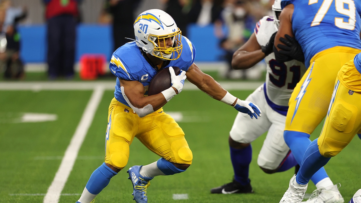 Los Angeles Chargers running back Austin Ekeler (30) runs with the ball during the first quarter against the Buffalo Bills at SoFi Stadium.