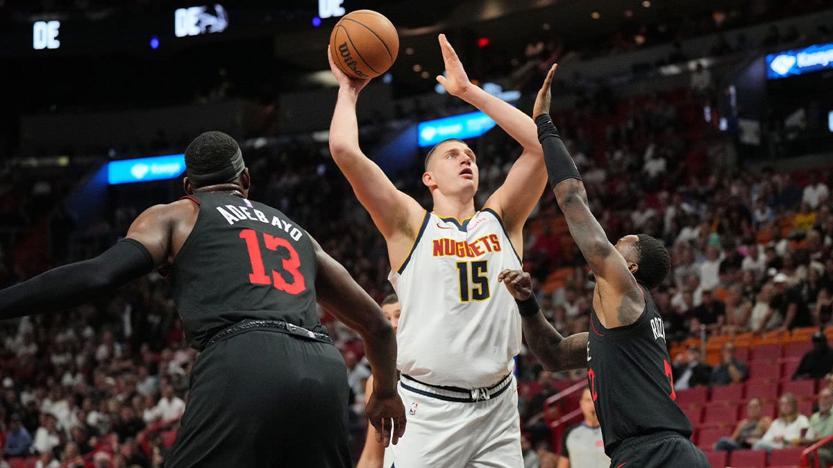 Denver Nuggets center Nikola Jokic (15) takes a shot over Miami Heat guard Terry Rozier (2) during the first half at Kaseya Center. 