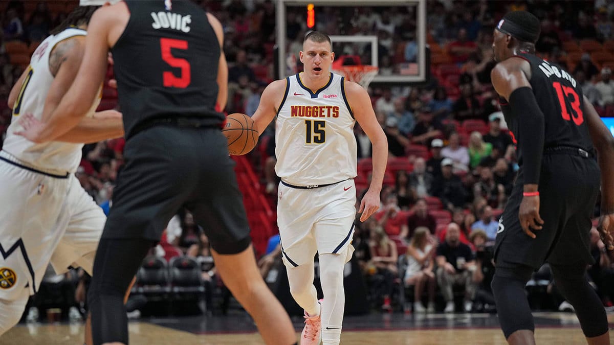 Denver Nuggets center Nikola Jokic (15) brings the ball up the court against the Miami Heat during the first half at Kaseya Center.