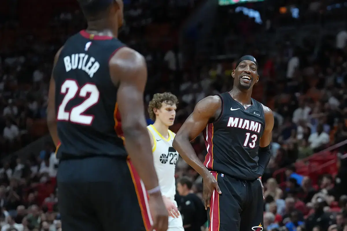 Miami Heat center Bam Adebayo (13) shares a laugh with Miami Heat forward Jimmy Butler (22) in the fourth quarter at Kaseya Center. 
