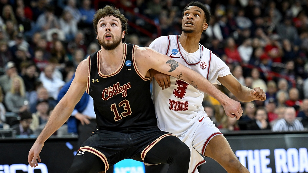 Charleston Cougars forward Ben Burnham (13) boxes out Alabama Crimson Tide guard Rylan Griffen (3) during the second half in the first round of the 2024 NCAA Tournament at Spokane Veterans Memorial Arena