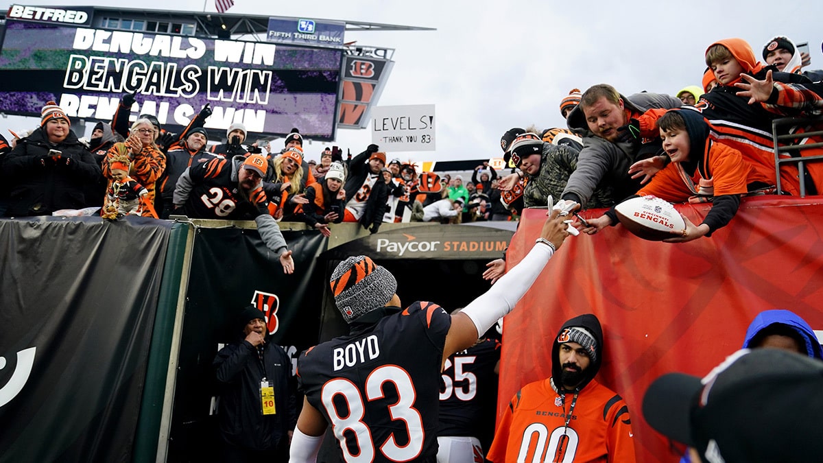 Cincinnati Bengals wide receiver Tyler Boyd (83) hands his gloves to a fan at the conclusion of a Week 18 NFL football game between the Cleveland Browns at Cincinnati Bengals, Sunday, Jan. 7, 2024, at Paycor Stadium in Cincinnati.