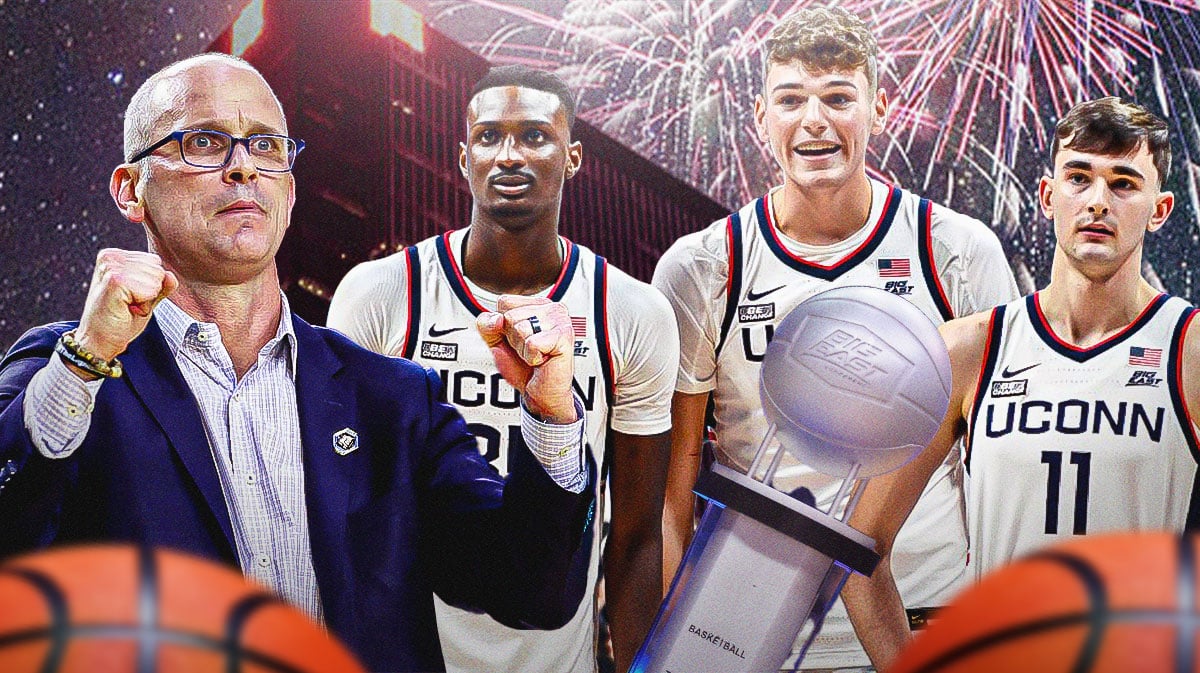 Dan Hurley, UConn basketball players, Big East Tournament trophy, fireworks going off