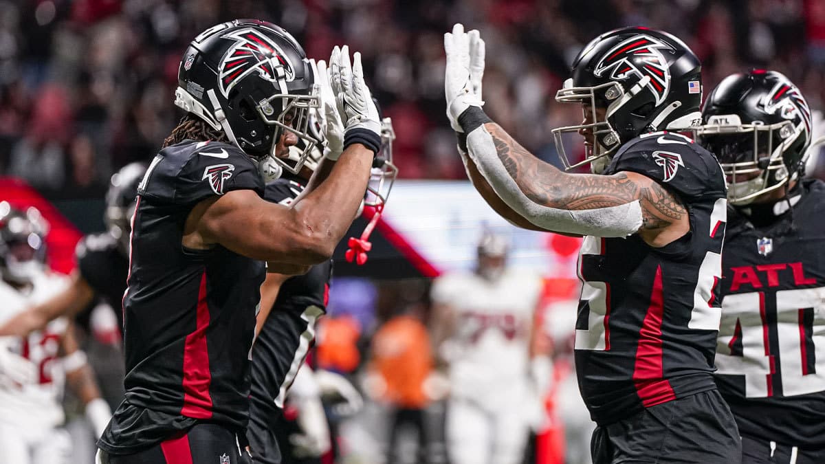 Atlanta Falcons running back Bijan Robinson (7) reacts with running back Tyler Allgeier (25) after running for a touchdown against the Tampa Bay Buccaneers during the second half at Mercedes-Benz Stadium