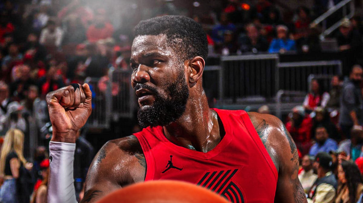 Portland Trail Blazers star Deandre Ayton in front of the Moda Center.