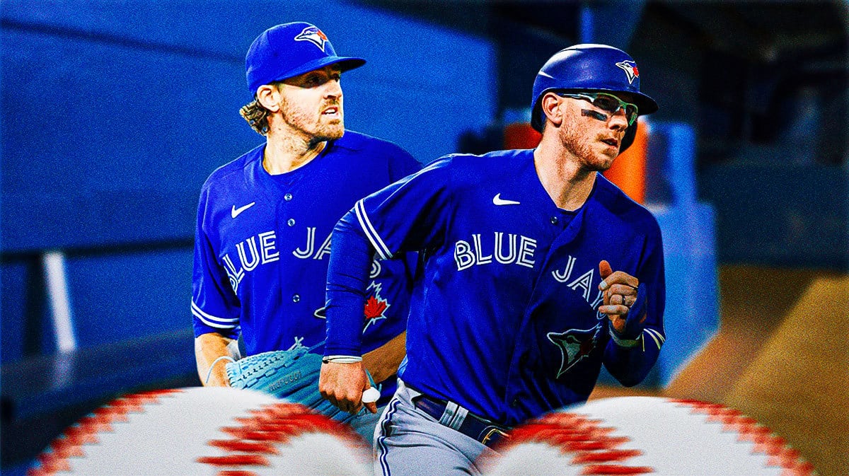 Blue Jays' Kevin Gausman and Blue Jays' Danny Jansen both in an MLB dugout looking serious/upset.