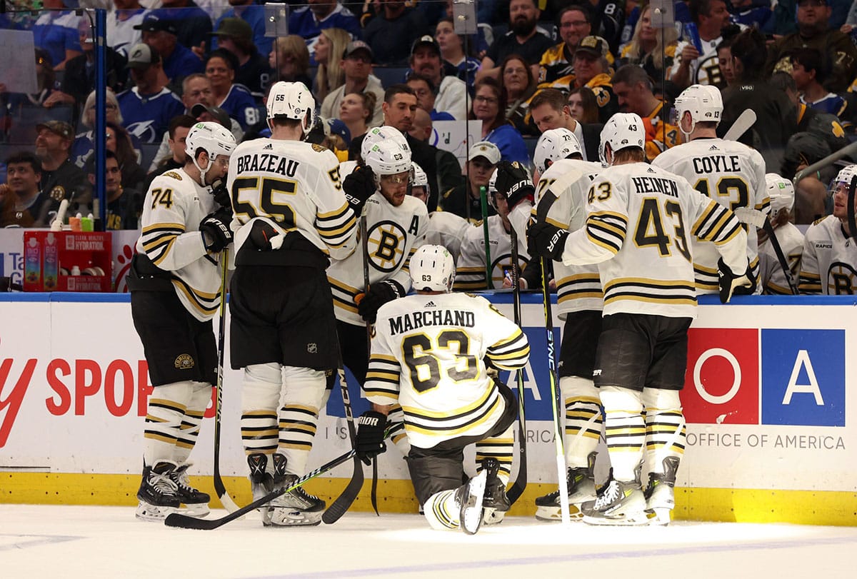 Boston Bruins left wing Brad Marchand (63) and teammates huddle up against the Tampa Bay Lightning during the third period at Amalie Arena.