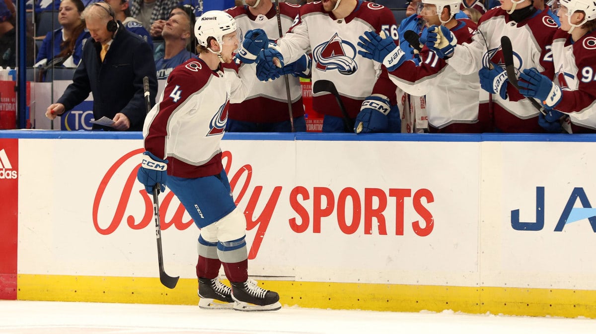 Colorado Avalanche defenseman Bowen Byram (4) celebrates with teammates after he scored a goal against the Tampa Bay Lightning during the first period at Amalie Arena.