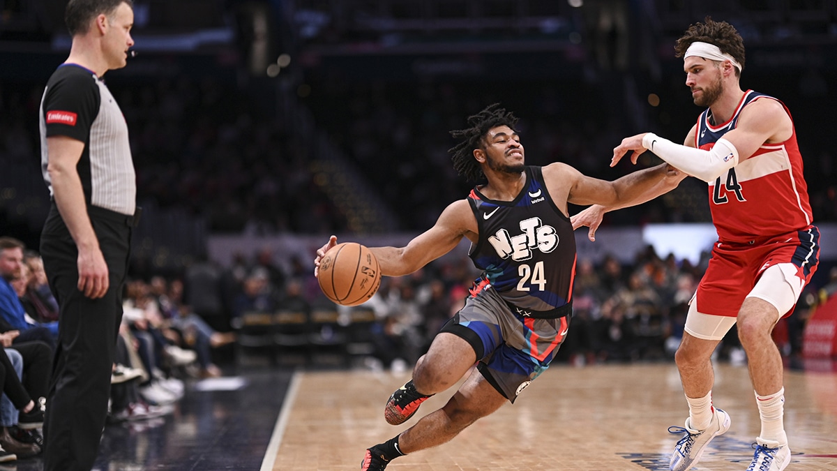 Brooklyn Nets guard Cam Thomas (24) makes a move to the basket as Washington Wizards forward Corey Kispert (24) defends during the first half at Capital One Arena. 
