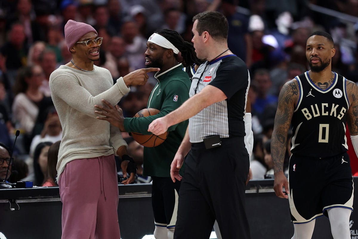 Los Angeles Clippers guard Russell Westbrook (left) talks with Milwaukee Bucks guard Patrick Beverley (21) during the second half at Crypto.com Arena.