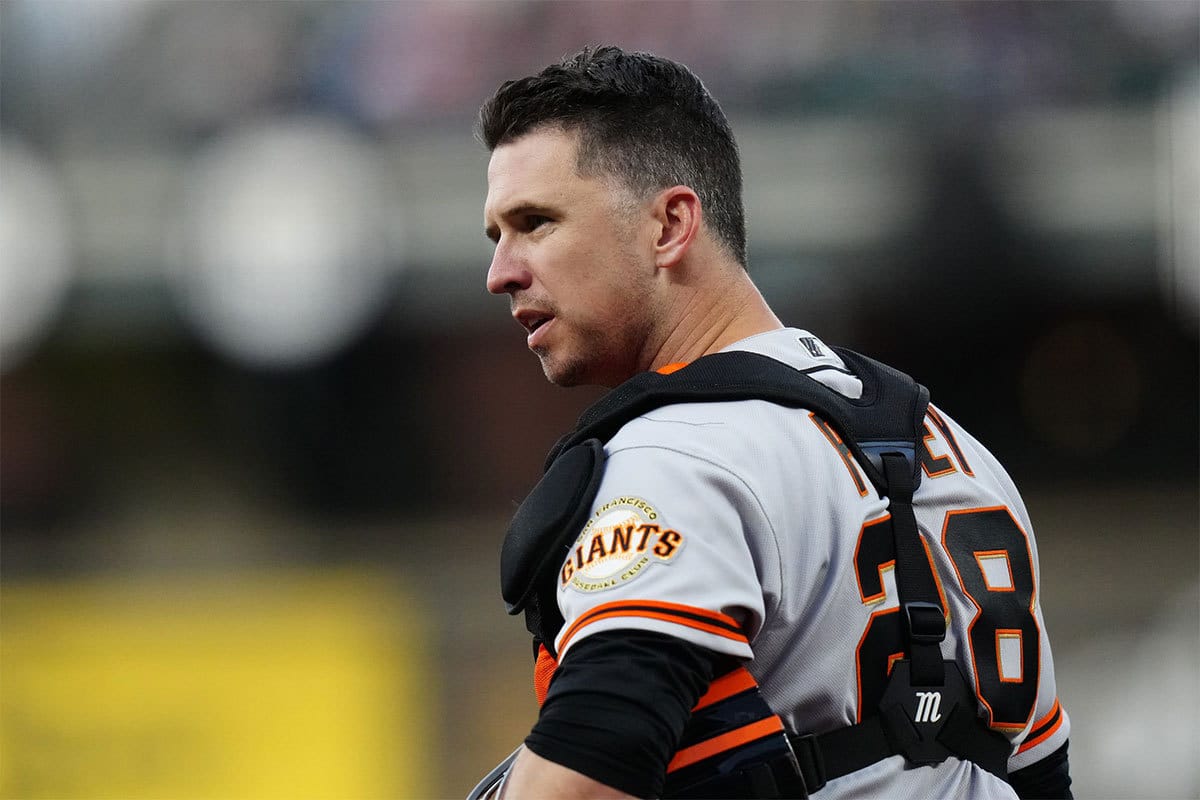 San Francisco Giants catcher Buster Posey (28) looks to towards the dugout in the first inning against the Colorado Rockies at Coors Field. 
