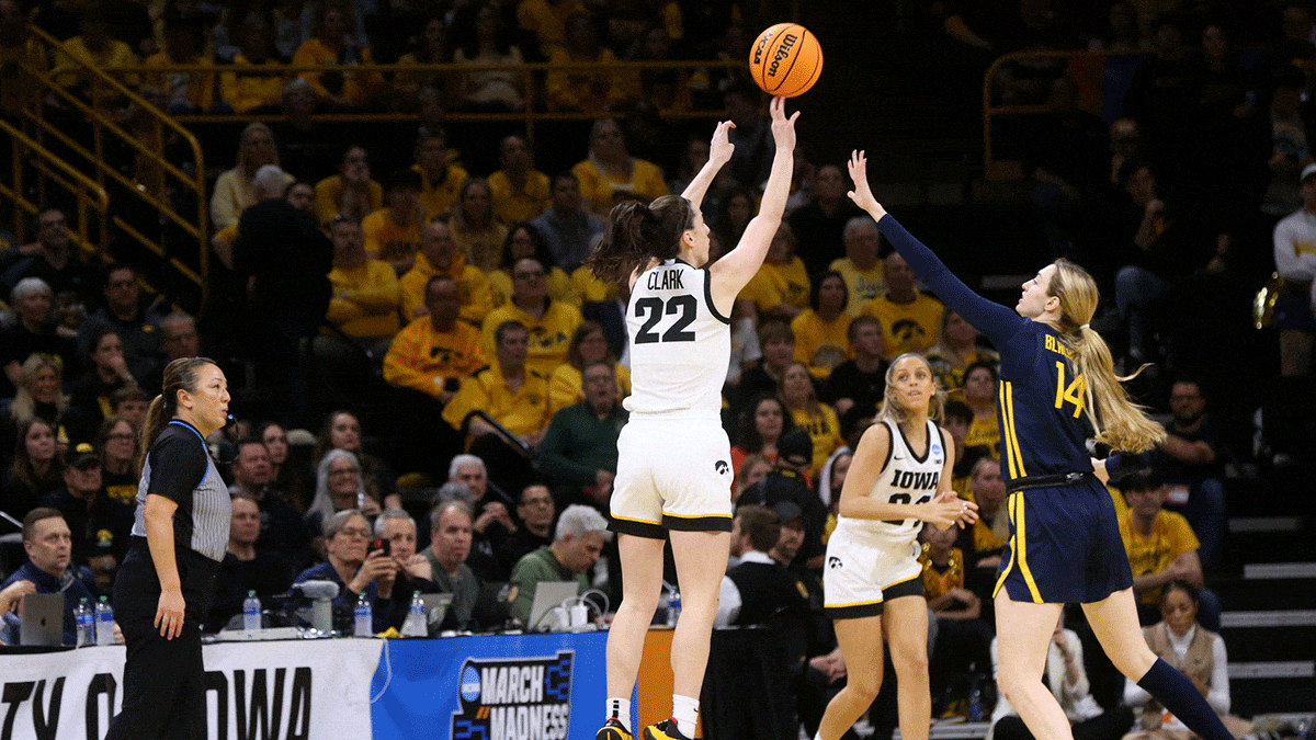 Iowa’s Caitlin Clark (22) shoots as West Virginia’s Kylee Blacksten (14) defends in a NCAA Tournament round of 32 game Monday, March 25, 2024 at Carver-Hawkeye Arena in Iowa City, Iowa.