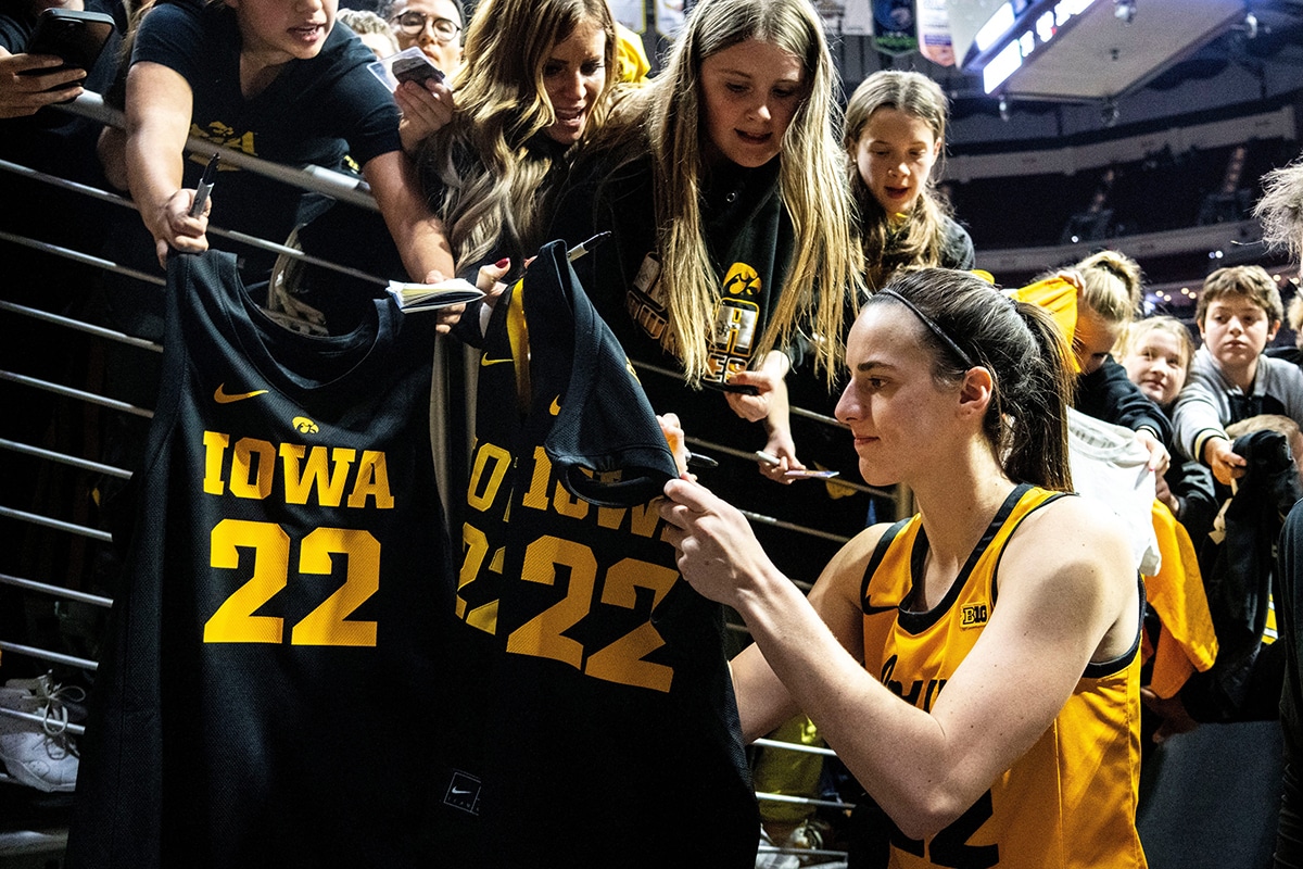 Iowa guard Caitlin Clark signs autographs for fans during the Hawkeye Showcase