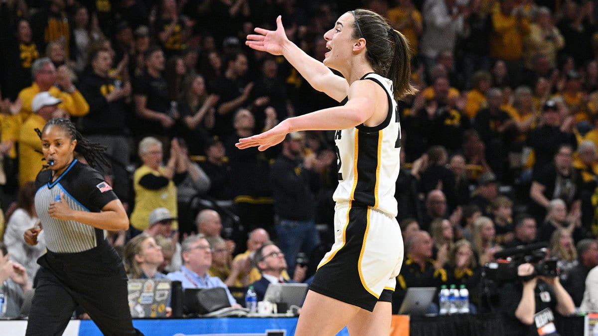 Iowa Hawkeyes guard Caitlin Clark (22) reacts to the crowd as they play the West Virginia Mountaineers