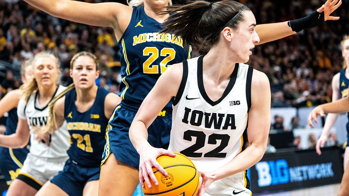 Iowa guard Caitlin Clark (22) looks to pass the ball during the Big Ten Tournament semifinals at the Target Center on Saturday, March 9, 2024, in Minneapolis, Minn.