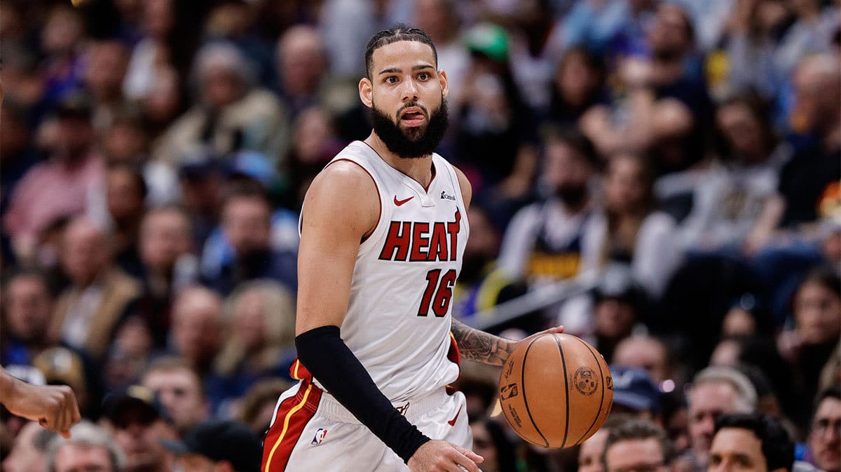 Miami Heat forward Caleb Martin (16) dribbles the ball up court in the third quarter against the Denver Nuggets at Ball Arena.