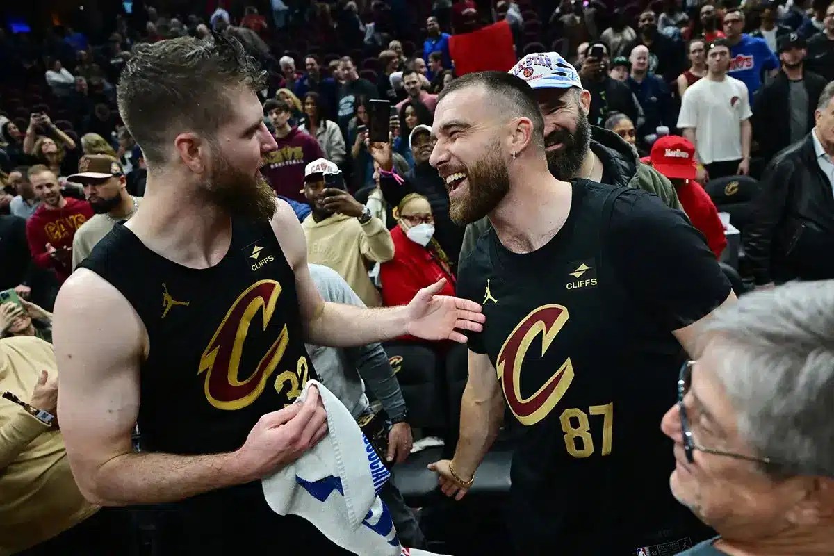 Cleveland Cavaliers forward Dean Wade, left, celebrates with Kansas City Chiefs tight end and Cleveland native Travis Kelce after the Cavaliers beat the Boston Celtics during the second half at Rocket Mortgage FieldHouse