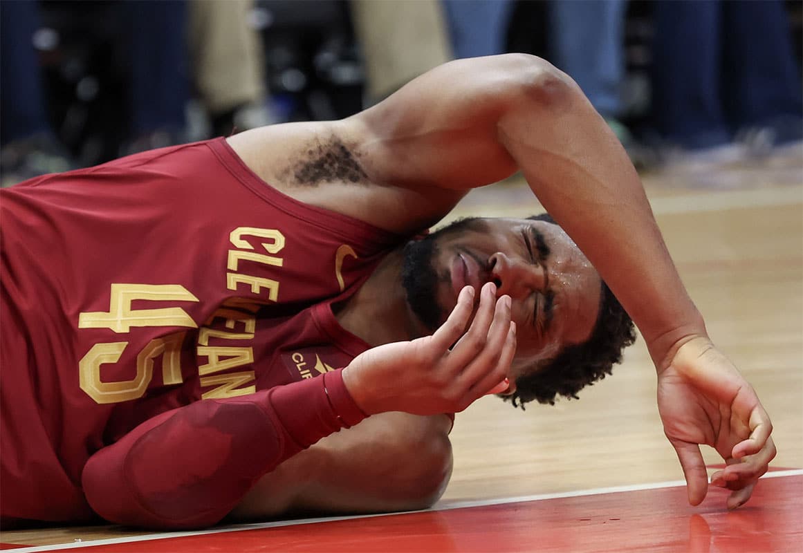 Cleveland Cavaliers guard Donovan Mitchell (45) reacts after teammate Tristan Thompson hit him in the nose with his elbow while reaching for a rebound against the Houston Rockets in the second half at Toyota Center. 