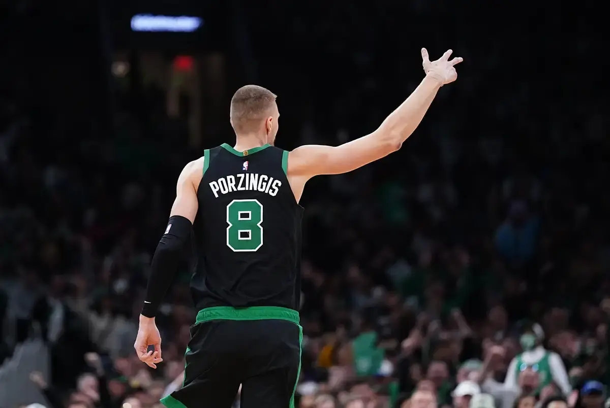 Celtics center Kristaps Porzingis (8) reacts after his three point basket