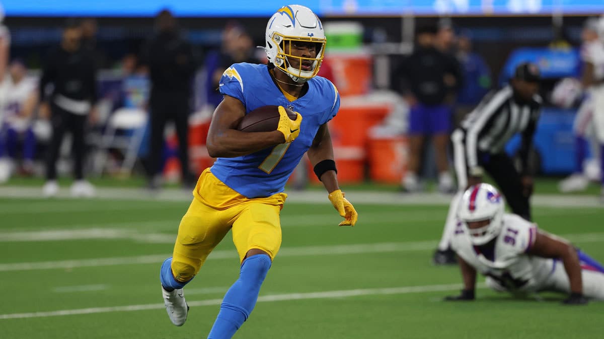 Los Angeles Chargers wide receiver Quentin Johnston (1) runs with the ball during the third quarter against the Buffalo Bills at SoFi Stadium.