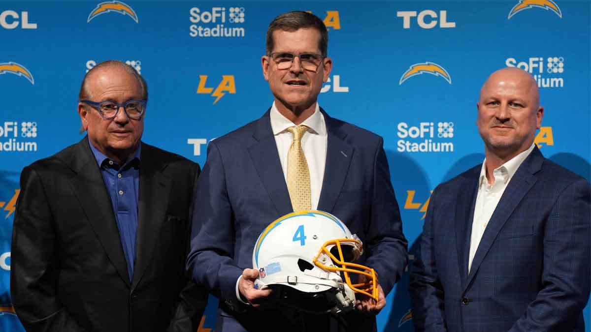 Chargers owner Dean Spanos (left), coach Jim Harbaugh (center) and general manager Joe Hortiz pose at an introductory press conference at YouTube Theater at SoFi Stadium.