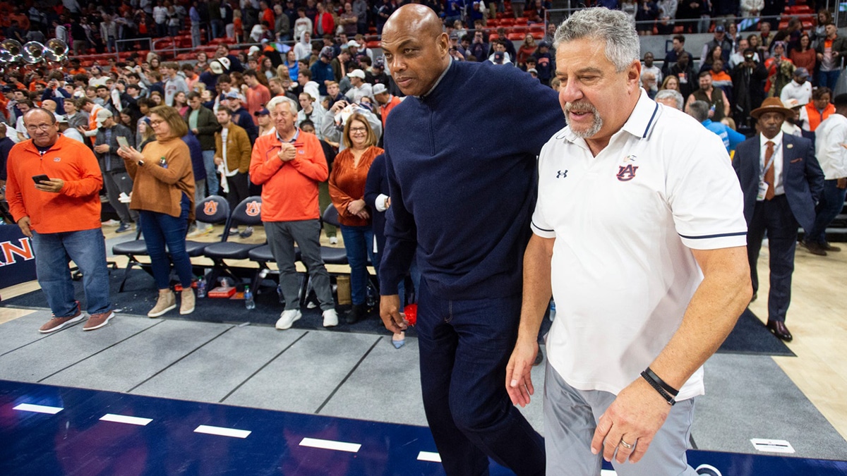 Former Auburn basketball player Charles Barkley and Auburn Tigers head coach Bruce Pearl take the court after the game as Auburn Tigers take on USC Trojans