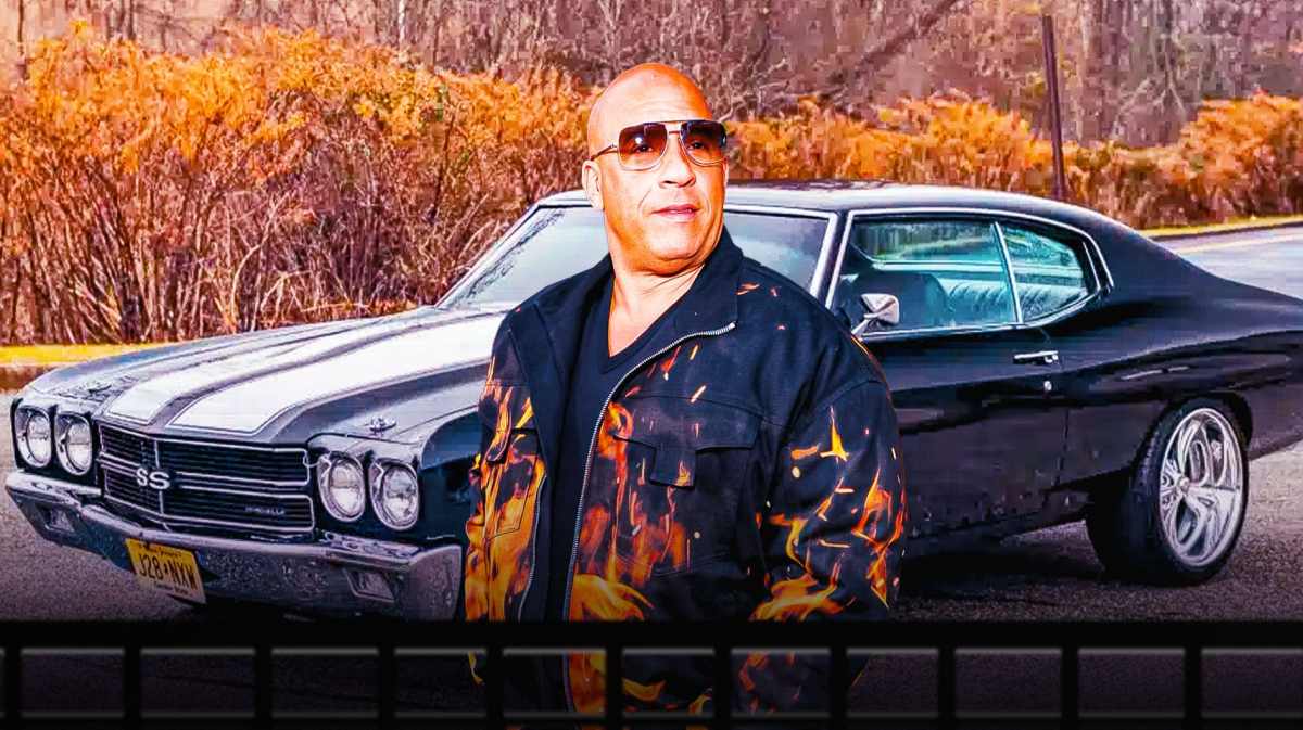 Vin Diesel in front of a car from his collection.