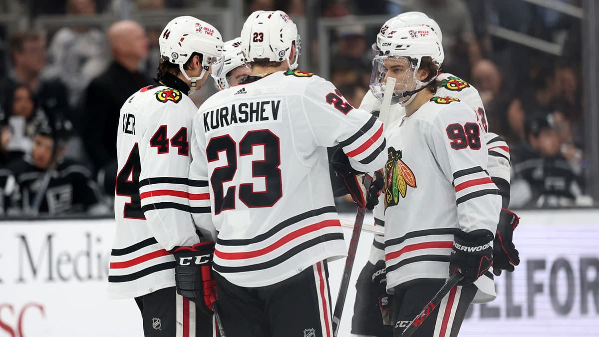 Chicago Blackhawks defenseman Wyatt Kaiser (44) and center Philipp Kurashev (23) and center Connor Bedard (98) on the ice during the third period against the Los Angeles Kings at Crypto.com Arena