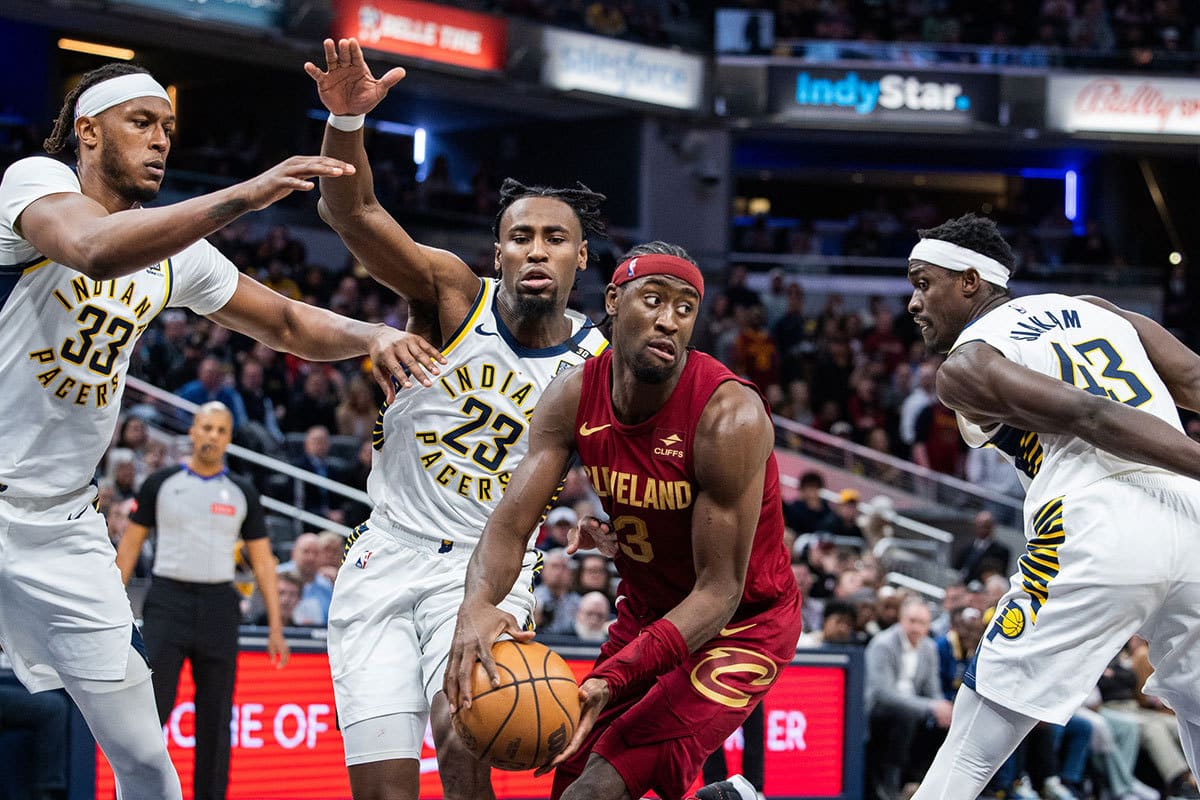 Cleveland Cavaliers guard Caris LeVert (3) passes the ball while Indiana Pacers center Myles Turner (33) forward Aaron Nesmith (23) and forward Pascal Siakam (43) defend in the second half at Gainbridge Fieldhouse. 