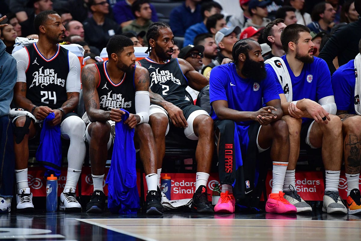 Los Angeles Clippers guard Norman Powell (24) forward Paul George (13) forward Kawhi Leonard (2) guard James Harden (1) and center Ivica Zubac (40) watch game action against the Dallas Mavericks during the second half Crypto.com Arena